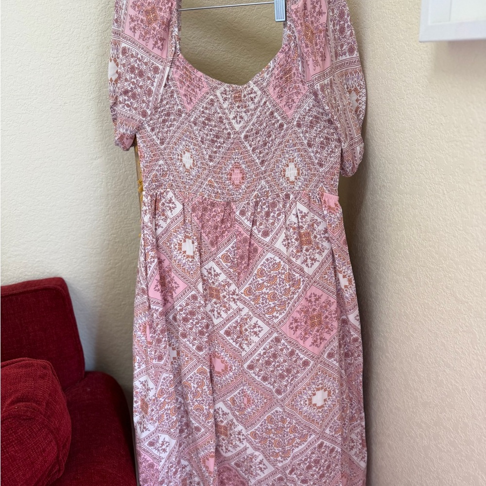 Love Blossom boho-style dress in a soft pink and cream patchwork floral print.
